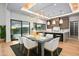 Bright dining room features a large table with white chairs, and a modern chandelier at 38152 N 109Th St, Scottsdale, AZ 85262