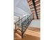 Modern staircase with wood treads and metal railing at 38152 N 109Th St, Scottsdale, AZ 85262