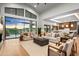 Open concept living room with fireplace and large windows at 38152 N 109Th St, Scottsdale, AZ 85262