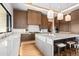 Modern kitchen with wood cabinets and a large island with seating at 38152 N 109Th St, Scottsdale, AZ 85262