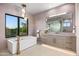 Luxurious bathroom with soaking tub and modern finishes at 38152 N 109Th St, Scottsdale, AZ 85262