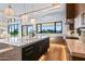 Modern kitchen with large island and dark wood cabinets at 38152 N 109Th St, Scottsdale, AZ 85262