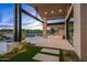 Covered patio with outdoor kitchen and fire pit at 38152 N 109Th St, Scottsdale, AZ 85262