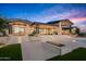 Luxury home with backyard patio, fire pit, pool, and stunning sunset view at 38152 N 109Th St, Scottsdale, AZ 85262