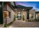 Elegant entryway with a large glass door and stone accents at 38152 N 109Th St, Scottsdale, AZ 85262