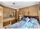 Bedroom with wood-paneled walls, double bed, and wood nightstand at 3330 E Main St # 9, Mesa, AZ 85213