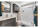 Bathroom with gray vanity, shower/tub combo, and a medicine cabinet at 3330 E Main St # 9, Mesa, AZ 85213