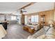Open living room with laminate flooring and access to the kitchen at 3330 E Main St # 9, Mesa, AZ 85213