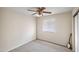 Simple bedroom with ceiling fan and window blinds at 4010 W Campo Bello Dr, Glendale, AZ 85308