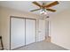 Bedroom with double door closet and access to hallway at 4010 W Campo Bello Dr, Glendale, AZ 85308