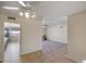 Open concept living room with tile flooring and views into kitchen and other rooms at 4010 W Campo Bello Dr, Glendale, AZ 85308