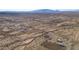 Aerial view of a property with a house and land, near a road and other homes at 52019 N Forepaugh Peak Rd, Wickenburg, AZ 85390