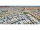 Aerial view of a residential neighborhood with houses, pools, and green areas at 14219 W Artemisa Ave, Surprise, AZ 85387