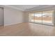 Living room with sliding glass doors and view of the backyard at 23942 N 171St Dr, Surprise, AZ 85387