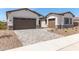 Two-car garage with paver driveway at 23942 N 171St Dr, Surprise, AZ 85387