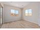 Dining area with wood-look tile flooring and natural light at 23942 N 171St Dr, Surprise, AZ 85387