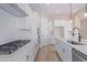 Bright kitchen featuring white cabinets, quartz countertops and stainless steel appliances at 23942 N 171St Dr, Surprise, AZ 85387