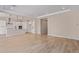 Spacious living room with light wood-look tile flooring and an open floor plan at 23942 N 171St Dr, Surprise, AZ 85387