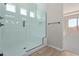 Spacious shower with glass enclosure and built-in seat at 23942 N 171St Dr, Surprise, AZ 85387