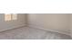 Bright bedroom with carpeted floors and window at 23942 N 171St Dr, Surprise, AZ 85387