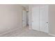 Bedroom with carpet, double door closet, and access to hallway at 23942 N 171St Dr, Surprise, AZ 85387