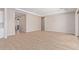 Bright and airy living room with wood-look tile flooring and access to the backyard at 23942 N 171St Dr, Surprise, AZ 85387