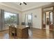 Spacious home office features hardwood floors, large windows, and built-in desk at 6990 E Buckhorn Trl, Scottsdale, AZ 85266