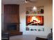 Elegant living room with a built-in entertainment center and fireplace at 6990 E Buckhorn Trl, Scottsdale, AZ 85266