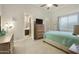 Comfortable bedroom with ensuite bathroom and dresser at 6990 E Buckhorn Trl, Scottsdale, AZ 85266