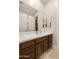 Double vanity bathroom with dark wood cabinets and white countertops at 6990 E Buckhorn Trl, Scottsdale, AZ 85266
