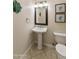Well-appointed powder room with pedestal sink and tiled floor at 6990 E Buckhorn Trl, Scottsdale, AZ 85266