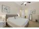 Main bedroom with king-size bed, ensuite bathroom access, and ceiling fan at 6990 E Buckhorn Trl, Scottsdale, AZ 85266