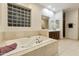 Relaxing bathroom with a jetted tub and a separate shower at 6990 E Buckhorn Trl, Scottsdale, AZ 85266
