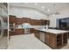 Bright kitchen with island, stainless steel appliances, and wood cabinets at 6990 E Buckhorn Trl, Scottsdale, AZ 85266