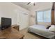 Bedroom with double bed, built-in desk, and large closet at 6990 E Buckhorn Trl, Scottsdale, AZ 85266
