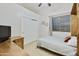 Bedroom with double bed, built-in desk, and large closet at 6990 E Buckhorn Trl, Scottsdale, AZ 85266