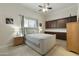 Bedroom with queen bed, built-in cabinets, and ceiling fan at 6990 E Buckhorn Trl, Scottsdale, AZ 85266