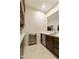 Wet bar with wine cooler, perfect for entertaining at 6990 E Buckhorn Trl, Scottsdale, AZ 85266