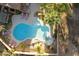 Aerial view of a freeform pool and spa with lounge chairs at 6990 E Buckhorn Trl, Scottsdale, AZ 85266