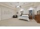 Main bedroom with carpeted floor, ceiling fan and large windows at 6990 E Buckhorn Trl, Scottsdale, AZ 85266