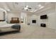 Main bedroom with carpeted floor, fireplace, and ensuite bathroom at 6990 E Buckhorn Trl, Scottsdale, AZ 85266