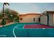 Private backyard basketball court with a hoop and defined playing area at 6990 E Buckhorn Trl, Scottsdale, AZ 85266
