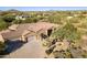 Luxury home with 3-car garage, expansive driveway and desert landscaping at 6990 E Buckhorn Trl, Scottsdale, AZ 85266