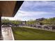 Landscaped backyard with artificial turf and a view of the pool at 12297 E Troon Vista Dr # 255, Scottsdale, AZ 85255