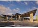 Contemporary community entrance with stone pillars and a large canopy at 12297 E Troon Vista Dr # 255, Scottsdale, AZ 85255
