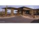 Elegant community entrance with stonework and desert landscaping at 12297 E Troon Vista Dr # 255, Scottsdale, AZ 85255