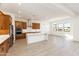 Open kitchen with island, wood cabinets, and stainless steel appliances at 630 N Star Ct, Apache Junction, AZ 85119