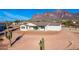 Aerial view of house showcasing backyard and mountain views at 630 N Star Ct, Apache Junction, AZ 85119