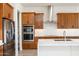 Modern kitchen with wood cabinets, stainless steel appliances, and a large island at 630 N Star Ct, Apache Junction, AZ 85119