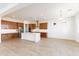 Open concept kitchen with island, double ovens and wood cabinets at 630 N Star Ct, Apache Junction, AZ 85119